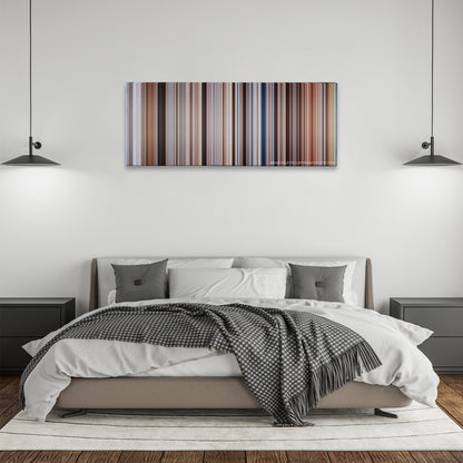 Waterworld color palette canvas above a bed, between two black pendant lamps