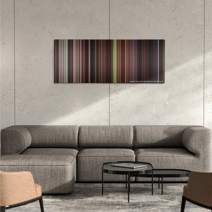 The Man in the Iron Mask color palette canvas on a concrete wall above a gray sectional sofa