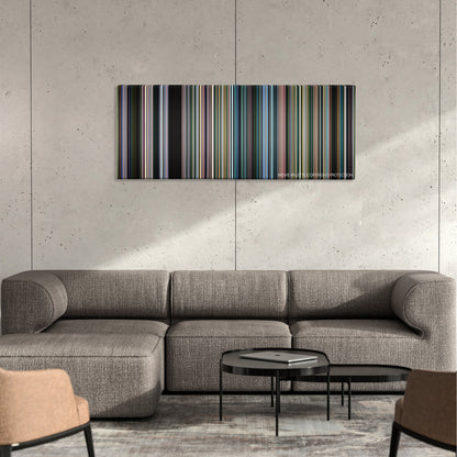 An Inconvenient Truth color palette canvas on a concrete wall above a gray sectional sofa