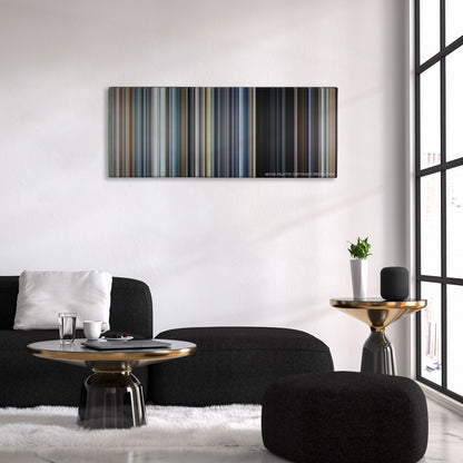 War of the Worlds color palette canvas above a black sofa with a gold-topped table