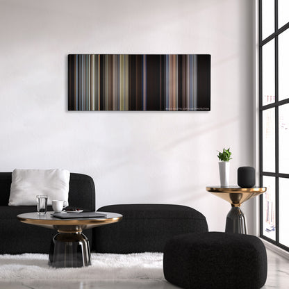 Unforgiven color palette canvas above a black sofa with a gold-topped table