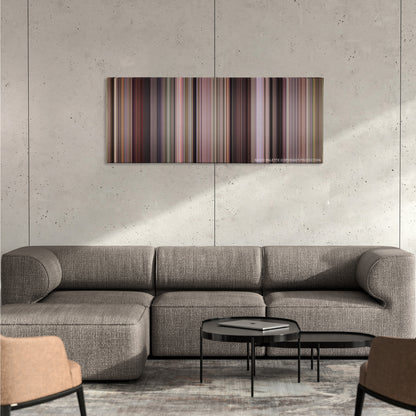 Road Trip color palette canvas on a concrete wall above a gray sectional sofa