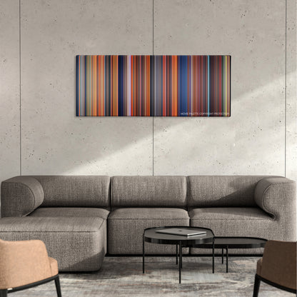 The Land Before Time color palette canvas on a concrete wall above a gray sectional sofa