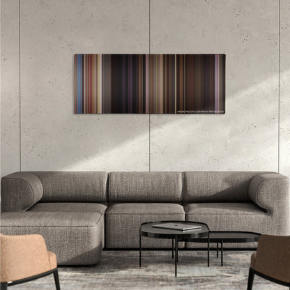 Horrible Bosses 2 color palette canvas on a concrete wall above a gray sectional sofa