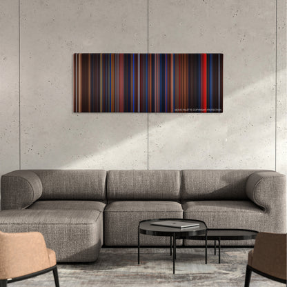 Flatliners color palette canvas on a concrete wall above a gray sectional sofa