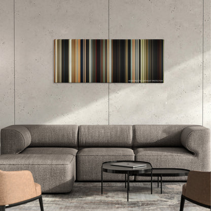 Brightburn color palette canvas on a concrete wall above a gray sectional sofa
