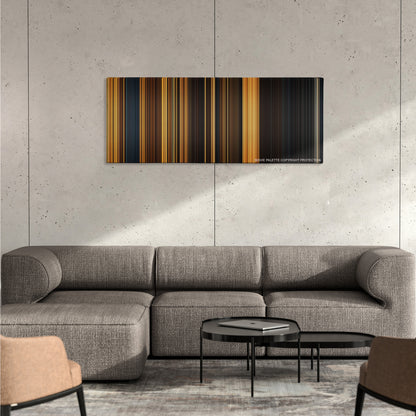 Riddick color palette canvas on a concrete wall above a gray sectional sofa
