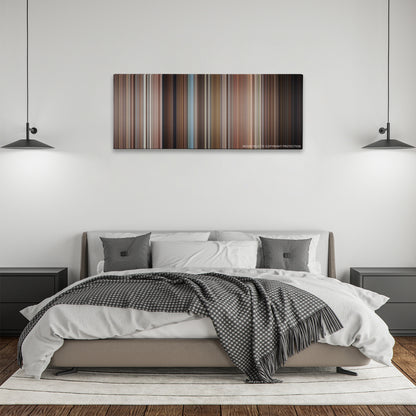 The Birds color palette canvas above a bed, between two black pendant lamps