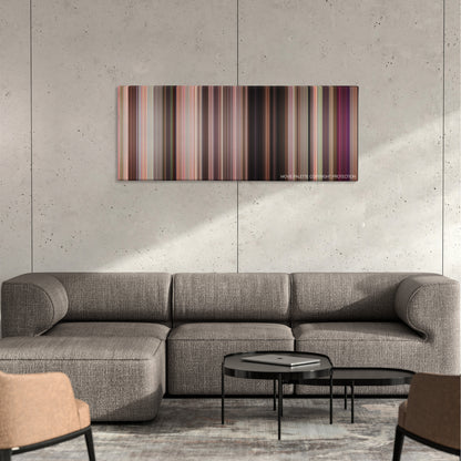 John Tucker Must Die color palette canvas on a concrete wall above a gray sectional sofa