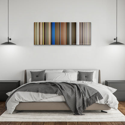 xXx color palette canvas above a bed, between two black pendant lamps