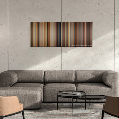 Garfield color palette canvas on a concrete wall above a gray sectional sofa