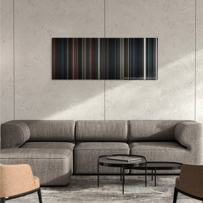 Insidious: Chapter 2 color palette canvas on a concrete wall above a gray sectional sofa