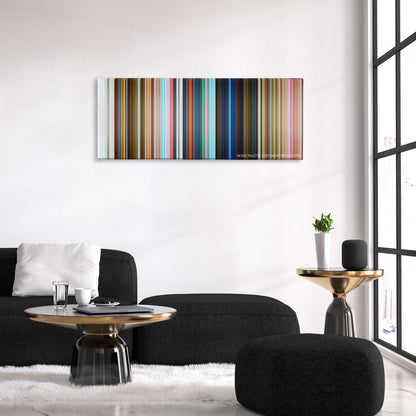 Penguins of Madagascar color palette canvas above a black sofa with a gold-topped table