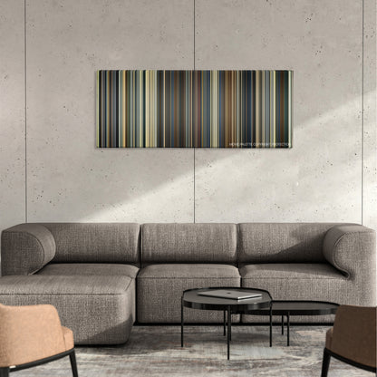 Eye in the Sky color palette canvas on a concrete wall above a gray sectional sofa