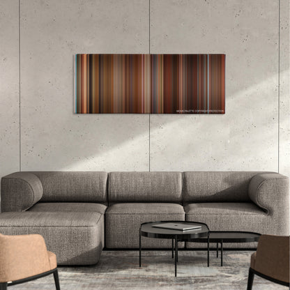 The House Bunny color palette canvas on a concrete wall above a gray sectional sofa