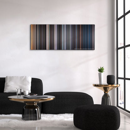 The Exorcist color palette canvas above a black sofa with a gold-topped table