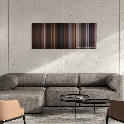 Wild Wild West color palette canvas on a concrete wall above a gray sectional sofa