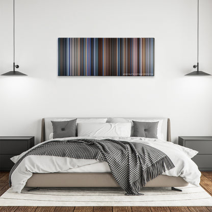 Wag The Dog color palette canvas above a bed, between two black pendant lamps