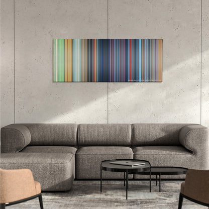 One Hundred and One Dalmatians color palette canvas on a concrete wall above a gray sectional sofa