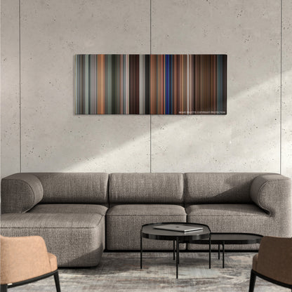 Rush Hour 3 color palette canvas on a concrete wall above a gray sectional sofa