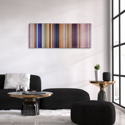 The Lorax color palette canvas above a black sofa with a gold-topped table
