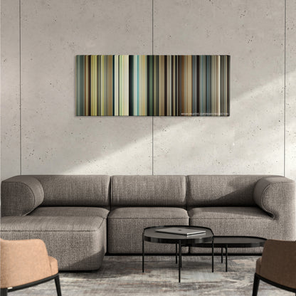 Unbroken color palette canvas on a concrete wall above a gray sectional sofa