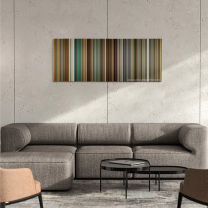 The Mechanic color palette canvas on a concrete wall above a gray sectional sofa