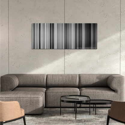La Haine color palette canvas on a concrete wall above a gray sectional sofa