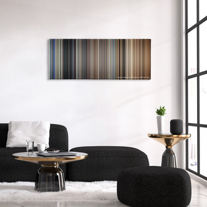 Assassins color palette canvas above a black sofa with a gold-topped table