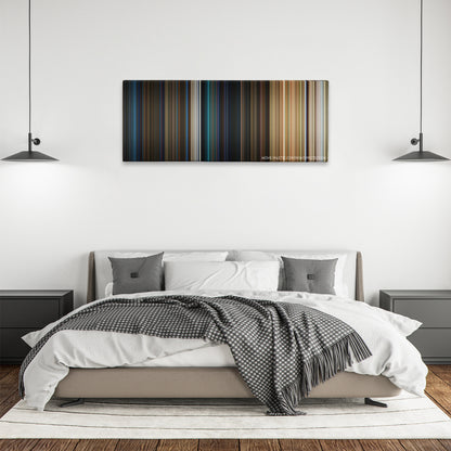 The BFG color palette canvas above a bed, between two black pendant lamps