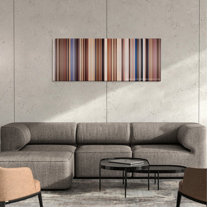 Holes color palette canvas on a concrete wall above a gray sectional sofa