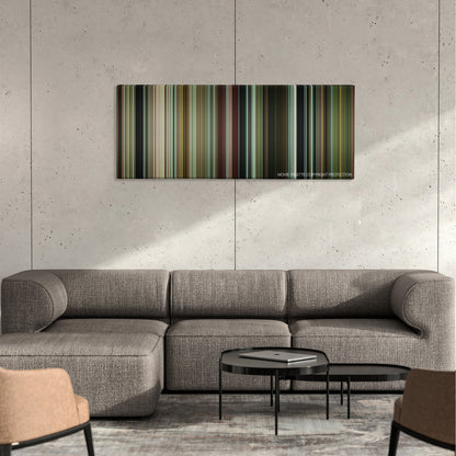 Horns color palette canvas on a concrete wall above a gray sectional sofa