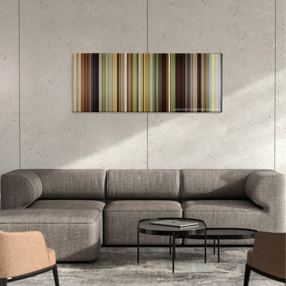 The Kings of Summer color palette canvas on a concrete wall above a gray sectional sofa