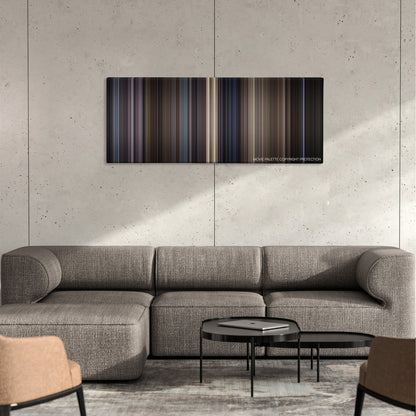 Along Came a Spider color palette canvas on a concrete wall above a gray sectional sofa