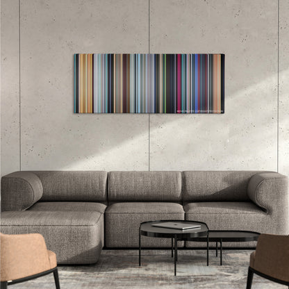 Monsters vs. Aliens color palette canvas on a concrete wall above a gray sectional sofa