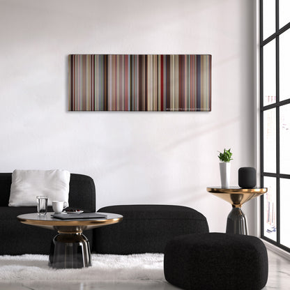 Boyhood color palette canvas above a black sofa with a gold-topped table