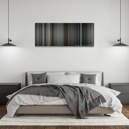 The Ghost Writer color palette canvas above a bed, between two black pendant lamps