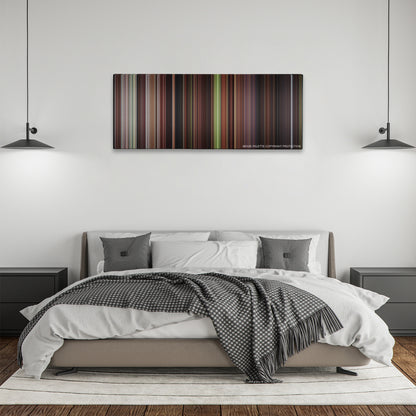 The Man in the Iron Mask color palette canvas above a bed, between two black pendant lamps