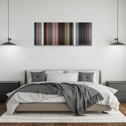 Rise of the Guardians color palette canvas above a bed, between two black pendant lamps