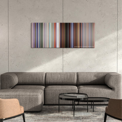 Cars 3 color palette canvas on a concrete wall above a gray sectional sofa