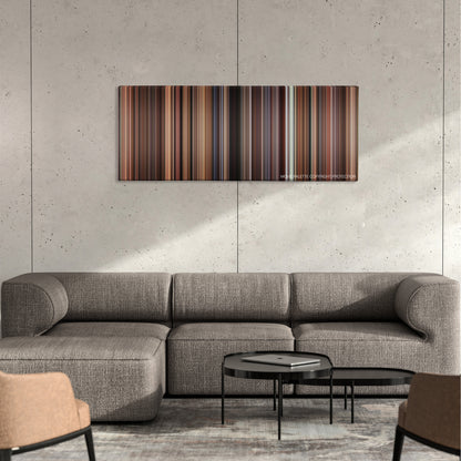 Mona Lisa Smile color palette canvas on a concrete wall above a gray sectional sofa