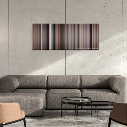 The Wild Bunch color palette canvas on a concrete wall above a gray sectional sofa