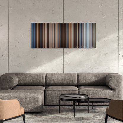 Hidalgo color palette canvas on a concrete wall above a gray sectional sofa