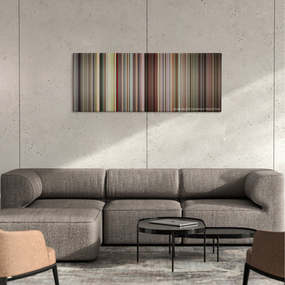 Detachment color palette canvas on a concrete wall above a gray sectional sofa
