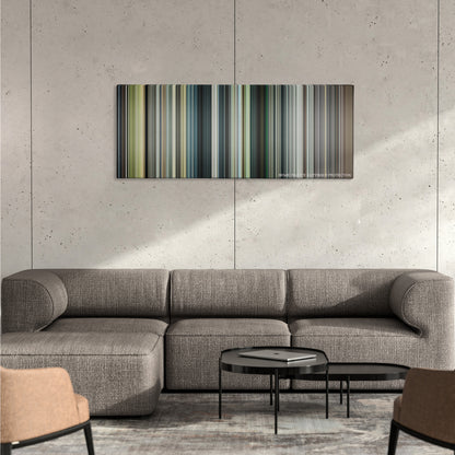 Rampage color palette canvas on a concrete wall above a gray sectional sofa