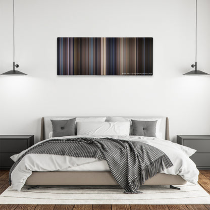 Along Came a Spider color palette canvas above a bed, between two black pendant lamps