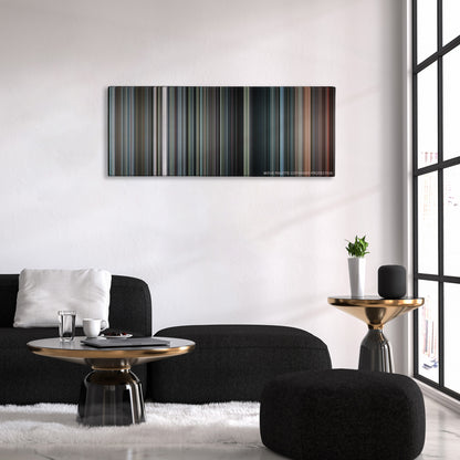Inside Man color palette canvas above a black sofa with a gold-topped table