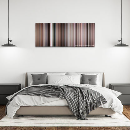 The Wild Bunch color palette canvas above a bed, between two black pendant lamps