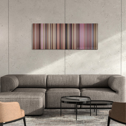 Kingpin color palette canvas on a concrete wall above a gray sectional sofa