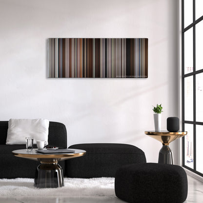 50/50 color palette canvas above a black sofa with a gold-topped table